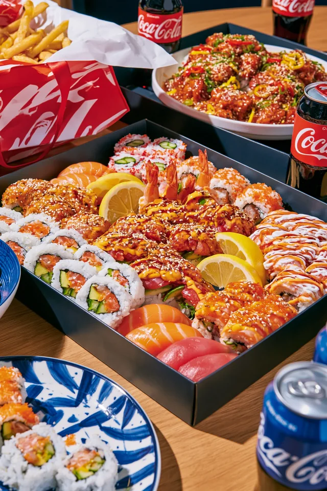Takeaway sushi, sides and drinks.