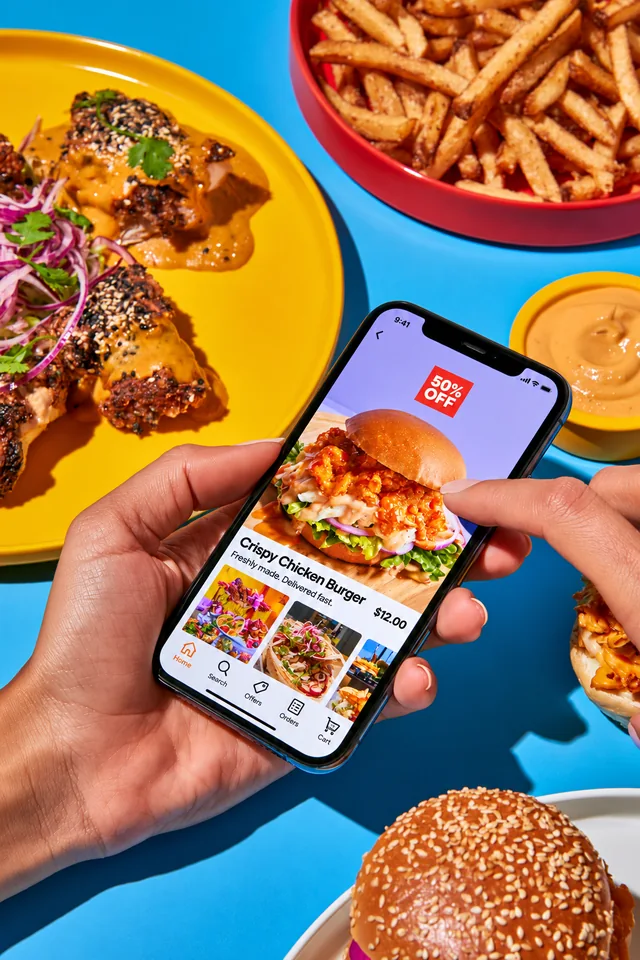 A customer browsing a food offer on a phone.